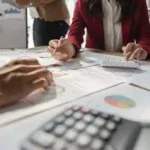 Accounting documents being reviewed.